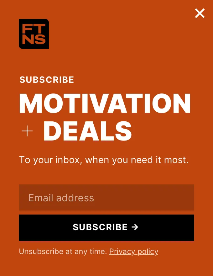 Ftns - slidein subscribe orange slide-in template shown on an example website
